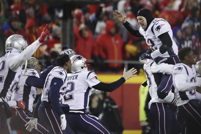 New England Patriots quarterback Tom Brady (12) celebrates with his teammates after the Patriots won the AFC Championship Game in overtime against the Kansas City Chiefs on Sunday in Kansas City, Mo. [Photo by AP]