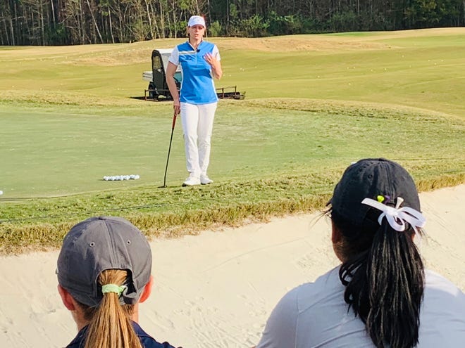World Golf Hall of Fame member Annika Sorenstam talks to players Saturday at the American Junior Golf Association Annika Invitational about the importance of the short game during a clinic at the Slammer & Squire golf course. [Garry Smits/GateHouse Florida]