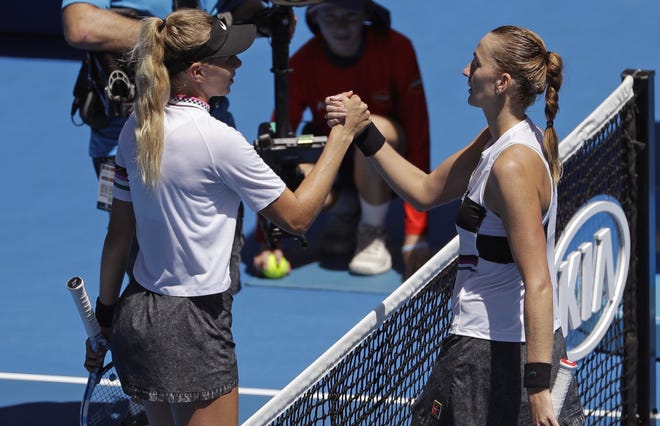 Petra Kvitova of the Czech Republic, right, is congratulated by the United States' Amanda Anisimova after winning their fourth-round match at the Australian Open in Melbourne on Sunday. [MARK SCHIEFELBEIN/THE ASSOCIATED PRESS]