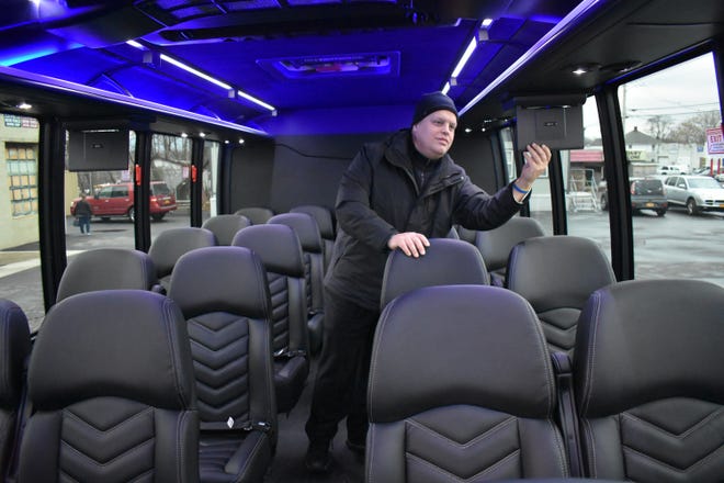 Sean Warren, a driver with Visconti Limousines in Newburgh, is shown in a truck that was modified into a mini bus. Gov. Andrew Cuomo has proposed sweeping new limo industry regulations, including banning "stretched" or remanufactured vehicles.