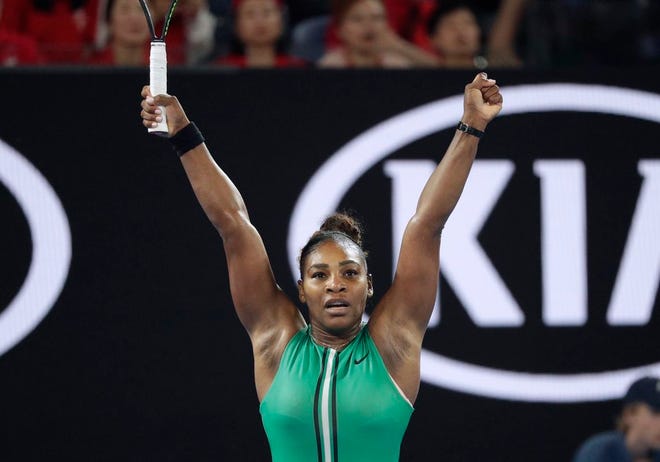 Serena Williams celebrates after defeating Romania's Simona Halep in their fourth round match at the Australian Open tennis championships in Melbourne, Australia, on Monday. [Kin Cheung/The Associated Press]