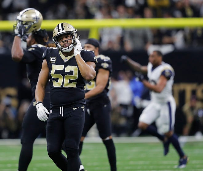 New Orleans Saints linebacker Craig Robertson (52) leaves the field after overtime of the NFL football NFC championship game against the Los Angeles Rams, Sunday, Jan. 20, 2019, in New Orleans. The Rams won 26-23. (AP Photo/Gerald Herbert)