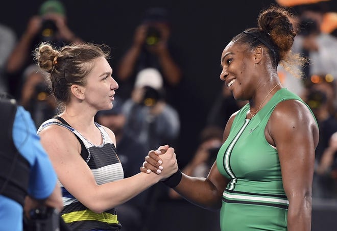 Serena Williams of the United States, right, is congratulated by Romania's Simona Halep after winning their fourth-round match at the Australian Open on Monday. [Andy Brownbill/AP]