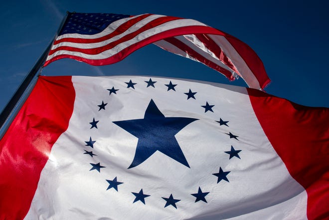 A Stennis flag flies under the United States flag on the roof of Fondren Corner in Jackson, Mississippi, on Jan. 11, 2019. Designed by Laurin Stennis, granddaugher of former Sen. John Stennis, D-Miss., the Stennis flag is a proposed alternative to the current state flag of Mississippi, which includes a Confederate symbol. MUST CREDIT: Photo for The Washington Post by Brandon Dill.