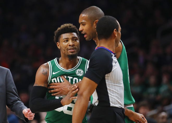 Marcus Smart was fined but not suspended for charging after an Atlanta player during Saturday's game. [Todd Kirkland/The Associated Press]