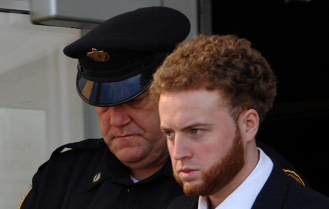 Thomas Latanowich is led out of Barnstable Superior Court after his August arraignment on charges he killed Yarmouth police Sgt. Sean Gannon. Latanowich faces assault charges in connection with an alleged attack on another inmate. [Steve Heaslip/Cape Cod Times file]