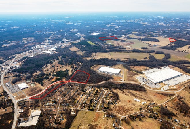 An aerial of the Flatwood property showing where Johnson Development's solar farms will be located. The large white-topped building is the Rite-Aid distribution center. The solar farm areas are outlined in red and should be around 10 to 15 acres each depending on specific site conditions. The areas where the company is placing the solar farms are not conducive to the construction of industrial buildings, Spartanburg County Councilman David Britt said. [PHOTO COURTESY JOHNSON DEVELOPMENT ASSOCIATES]