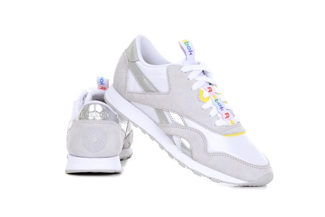 Exclusive Reebok sneakers from SoulCycle's collaboration with the brand. It has a hint of yellow and rainbow colors around its laces. [Photo courtesy of SoulCycle]