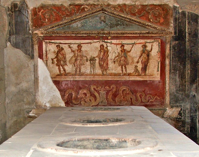 Thermopolium (hot-food concession), with vessels for sausages and other fast foods, first century A.D., Pompeii, Italy. [Daniele Florio/Wikimedia Commons]