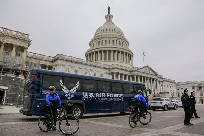An Air Force bus waits on the plaza of the Capitol after President Donald Trump used his executive power to deny military aircraft to House Speaker Nancy Pelosi just before she was depart to visit troops abroad, on Capitol Hill in Washington, Thursday, Jan. 17, 2019.(AP Photo/J. Scott Applewhite)