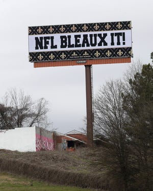 A billboard protesting a controversial call in the Sunday's NFC championship game between the New Orleans Saints and Los Angeles Rams is shown along Interstate 75 near Hartsfield Jackson Atlanta International Airport on Tuesday. [JOHN BAZEMORE/THE ASSOCIATED PRESS]