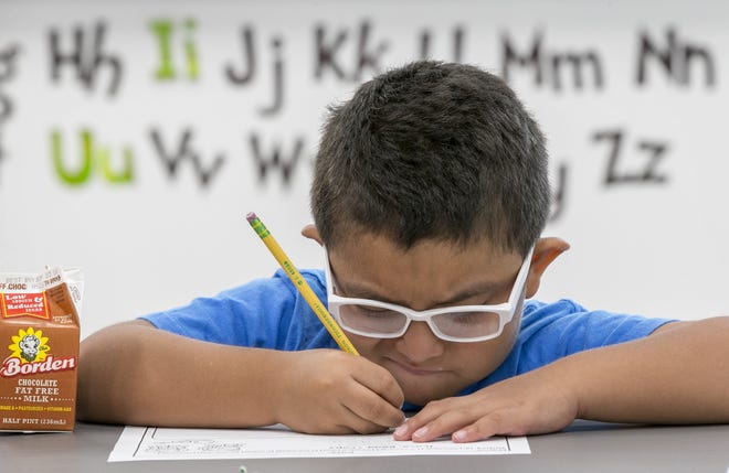 In this August, 2018 file photo, first-grader Pablo Lopez, 6, practices his handwriting at Austin Achieve charter school. [JAY JANNER / AMERICAN-STATESMAN]