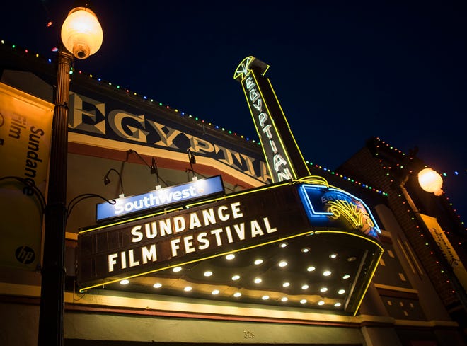 FILE - In this Thursday, Jan. 22, 2015, file photo, the Egyptian Theatre is lit up on Main Street during the first night of the Sundance Film Festival in Park City, Utah. The mountainside festival, which kicks off Thursday, Jan. 24, 2019, in Park City, Utah, has become known for launching nonfiction films to box office successes and awards, and this year is shaping up to be no different. (Photo by Arthur Mola/Invision/AP, File)