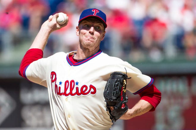 File-This Aug. 25, 2013, file photo shows Philadelphia Phillies starting pitcher Roy Halladay throwing a pitch during the third inning of a baseball game in Philadelphia. Halladay, an ace with the Toronto Blue Jays and Philadelphia Phillies, got 85.4 percent and will be the first posthumous inductee since Deacon White in 2013 and Ron Santo in 2012. Halladay died in November 2017 at 40 years old when an airplane he was flying crashed into the Gulf of Mexico off the coast of Florida. (AP Photo/Christopher Szagola, File)