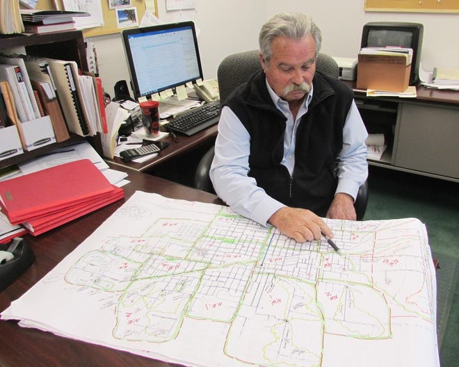 MIKE HELENTHAL/GATEHOUSE MEDIA ILLINOIS Recently retired Kewanee city engineer Dale Nobel has been named the likely new Stark County engineer. In this Oct. 18, 2017 photo, Nobel is shown reviewing a diagram of Kewanee’s city water system.