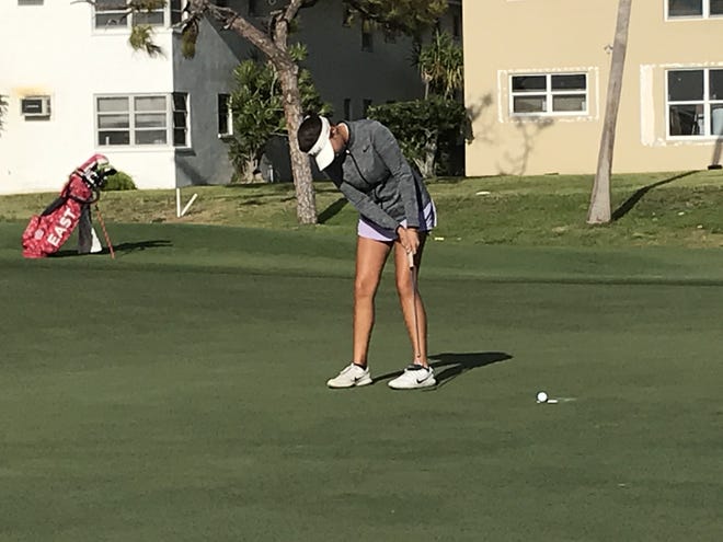 Alexa Pano sinks a par putt to halve the 4th hole in her match against Jamie Freedman on Wednesday at Coral Ridge Country Club. [STEVE WATERS/Special to The Post]