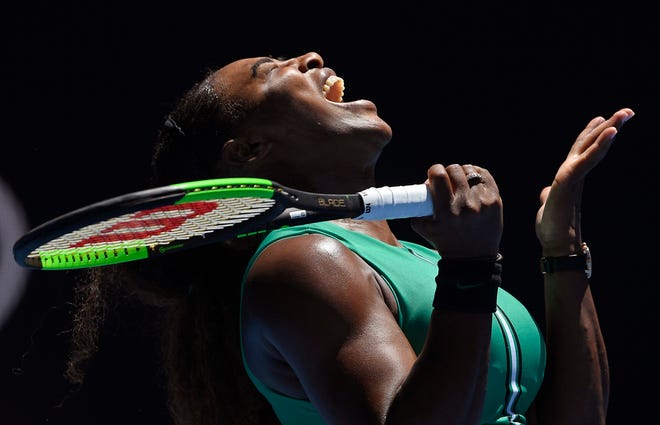 United States' Serena Williams reacts after losing a point to Karolina Pliskova of the Czech Republic during their quarterfinal match at the Australian Open tennis championships in Melbourne, Australia, Wednesday, Jan. 23, 2019. (AP Photo/Andy Brownbill)