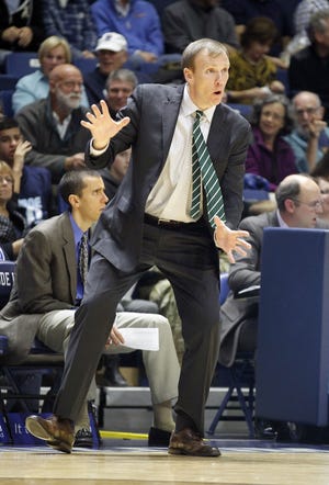 Dartmouth head coach David McLaughlin signals plays to his team during the first half of an NCAA college basketball game against Rhode Island, Friday, Nov. 11, 2016, in North Kingstown, R.I. (AP Photo/Stew Milne)