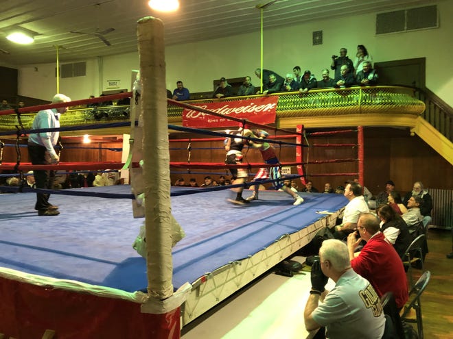 Michael Gaudreau (dark trunks) of the Fall River PAL battles Brady Magras at last week's Southern New England Golden Gloves at the PAL. The two are scheduled to meet again this Saturday in a special bout at the SNEGG finals.