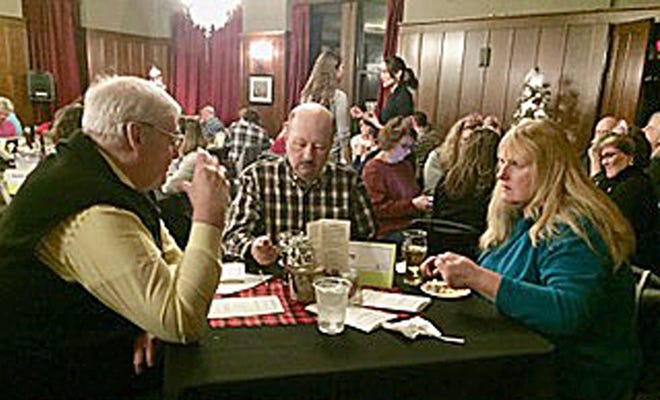 Gerry Coutu, left, Victor Poulin, and Dori Young put their knowledge to the test for the Sanford Lions Club's team during Literacy Volunteers of Greater Sanford's annual Trivia Night fundraiser at the Sanford Town Club on Friday, Jan. 18. 

[Courtesy photo]