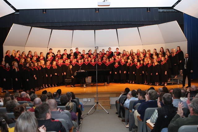 Vocalists in the Roland-Story High School Choir perform a concert to a standing-room-only crowd in December. Photo by Kevin Patterson