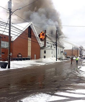 Firefighters battle a blaze at the former Harvest Christian Center in Minerva on Friday, Jan. 24, 2019. [Photo submitted by Roger Bartley]