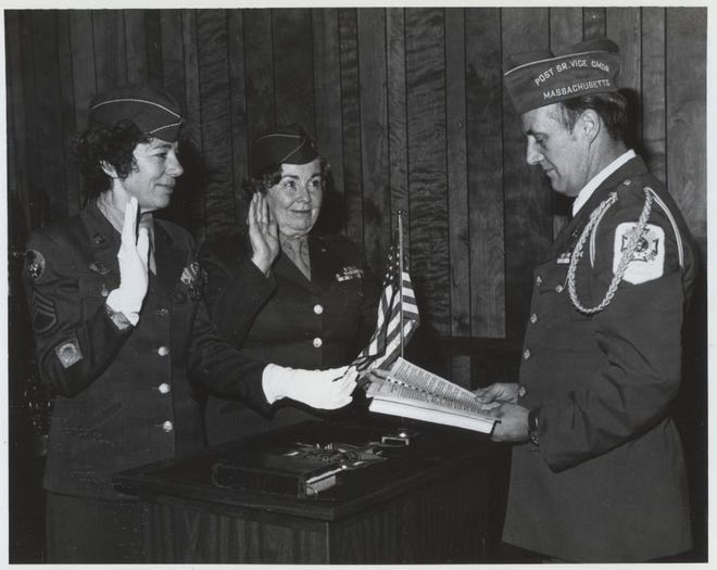 The first two women ever to be installed into the Hyannis V.F.W. Post 2578, officers Josephine Mills and Agnes D’Entremont, both of the U.S. Army, are given the oath by Commander Ronald L. Jordan in January 1979. [BARNSTABLE PATRIOT FILES/W.B. NICKERSON CAPE COD HISTORY ARCHIVES]