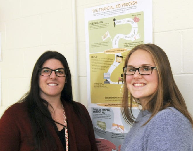Sandwich High School junior Rowan Rountree-Hanscom, right, and her teacher Megan Watterson. Rountree-Hanscom won a $500 scholarship from the state for a personal finance essay, but says the things she learned in the finance course taught by Watterson were invaluable. “This class is really important,” Rountree-Hanscom said. “It will give me a head start.” [Ron Schloerb/Cape Cod Times]