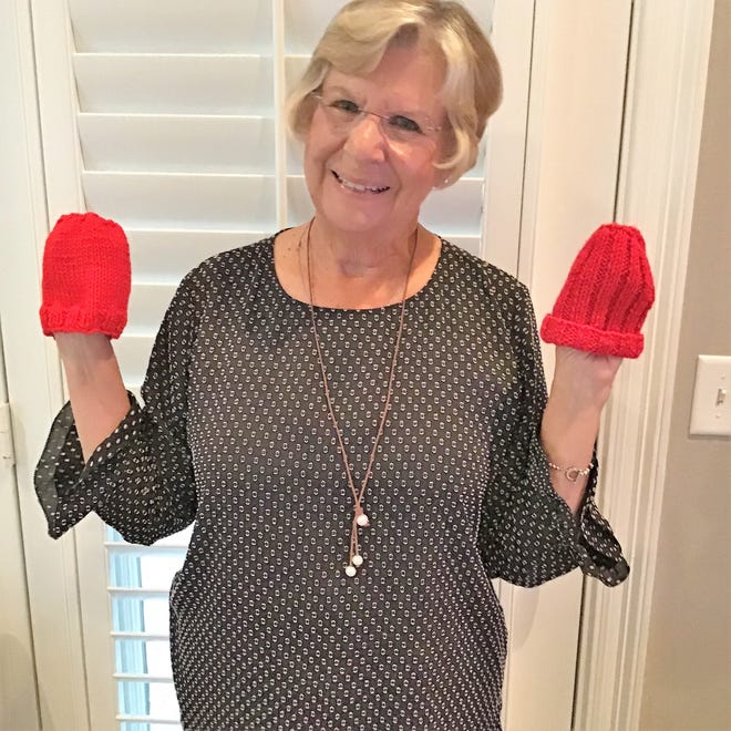 Mari Carroll, a snowbird from Ohio, has a group making little hats to help celebrate American Heart Month in February by knitting or crocheting newborn-size red hats symbolizing heart-healthy lives for both moms and their new babies. [CONTRIBUTED PHOTO]
