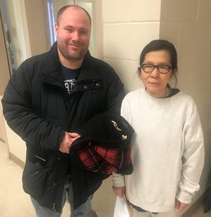 Etty Tham, right, a local Indonesian immigrant, was released from the Strafford County House of Corrections on Friday after a confinement of more than seven months. At left is her son-in-law, Mike Lockhardt of Dover. [John Doyle/Fosters.com]