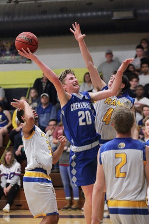Cherryville's Lane Harrill puts up a shot in the paint over several Highland Tech defenders Friday night in Gastonia. The Ironmen defeated the Rams 76-65 to improve to 14-3 on the season. [Brian Mayhew/Special to The Gazette]