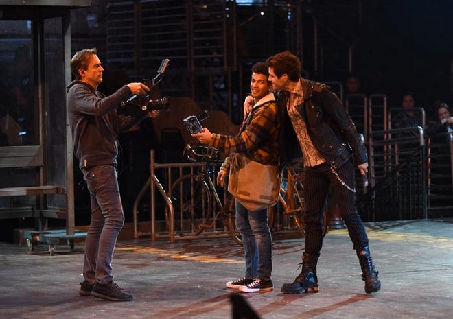 Jordan Fisher (center) rehearses a scene from Fox’s “Rent Live” with director Alex Rudzinski (left) and Brennin Hunt (right) in the weeks before the live television production, 8 p.m., Jan. 27. [Fox]