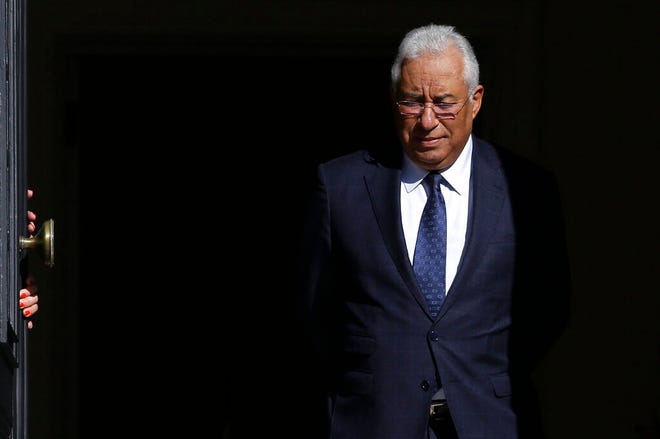In this photo taken Jan. 17, 2019, Portugal's Prime Minister Antonio Costa walks to the door of the Sao Bento palace in Lisbon. On Friday, Jan. 25, 2019, the speaker of Portugal's parliament has appealed for calm during a session debating racial tensions and police conduct after the prime minister asked whether his own skin color had prompted a lawmaker's questions. Costa, whose father's family is from India, said to the lawmaker, "It must be because of my skin color that you're asking me whether I condemn or don't condemn" police violence. The comment caused an uproar.