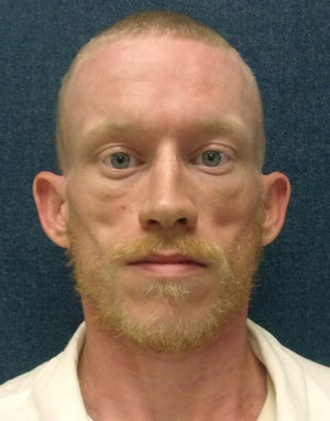This undated photo released by the Alabama Department of Corrections shows inmate Corey Aris Davis, who officials say escaped from his cell at the St. Clair Correctional Facility. The inmate was sentenced to life in prison in 2017 for two charges of human trafficking. [AP Photo/Alabama Department of Corrections]