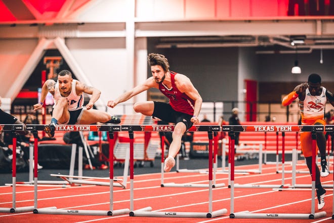 Texas Tech hurdler and Canyon graduate Norman Grimes, middle, wins the 60 meter hurdles during the Texas Tech Classic indoor track and field meet on Friday at the Red Raiders Sports Performance Center. [Elizabeth Hertel/ For the Amarillo Globe-News]