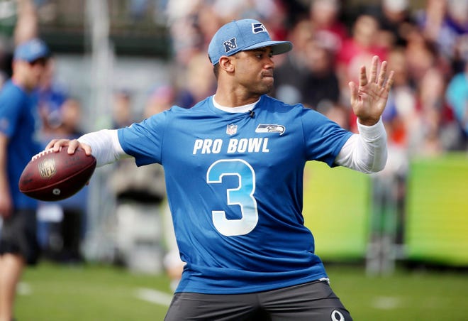 NFC Seattle Seahawks quarterback Russell Wilson throws during NFL football Pro Bowl practice in Orlando, Fla., Wednesday, Jan. 23, 2019. (Stephen M. Dowell/Orlando Sentinel via AP)/Orlando Sentinel via AP)