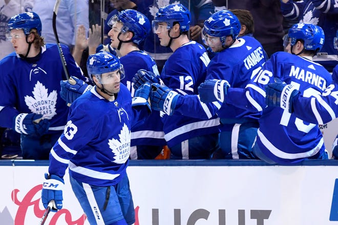 Toronto Maple Leafs center Nazem Kadri (43) celebrates his hat-trick goal during the third period of an NHL hockey game against the Washington Capitals, Wednesday, Jan. 23, 2019, in Toronto. (Nathan Denette/The Canadian Press via AP)