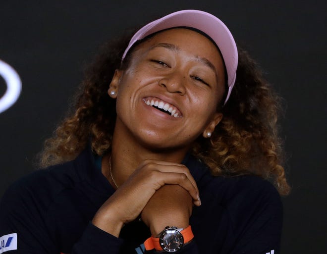 Japan's Naomi Osaka answers questions at a press conference after defeating Petra Kvitova of the Czech Republic in the women's singles final at the Australian Open tennis championships in Melbourne, Australia, early Sunday, Jan. 27, 2019. (AP Photo/Mark Schiefelbein)