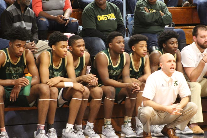 Coach Perry Tyndall and the team watched as the Vikings secured a 69-44 victory on the road Friday against South Lenoir. Thirteen different Vikings put points on the board in this contest. [Laieke Abebe/Free Press]
