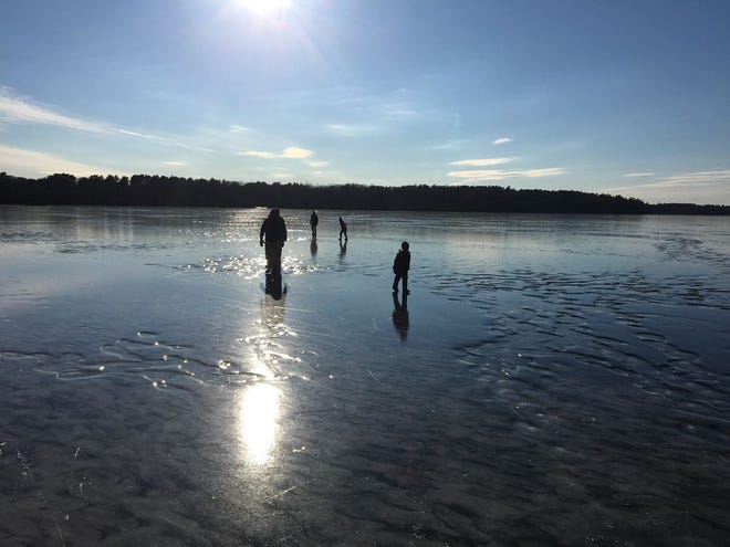 Family finds a new winter playground on Ponkapoag Pond in Canton