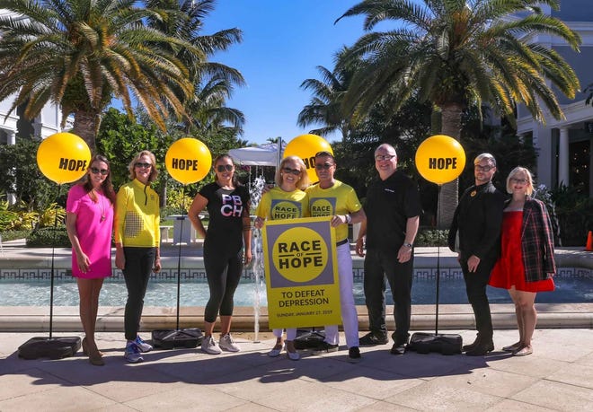 From left, Lilly Leas Ferreira, Louisa Benton, Anna Caballero, Audrey Gruss, Scott Snyder, Ron Soderblom, Collin Santini, and Lori Cleary gather at Royal Poinciana Plaza last week to kick off Race of Hope. The Palm Beach Race of Hope 5K will be run Sunday, starting at 8 a.m. [Damon Higgins/palmbeachdailynews.com]