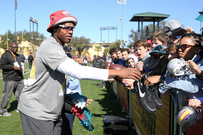 AFC cornerback Jalen Ramsey signs autographs for fans before Pro Bowl practice on Friday in Kissimmee. [Steve Luciano/The Associated Press]