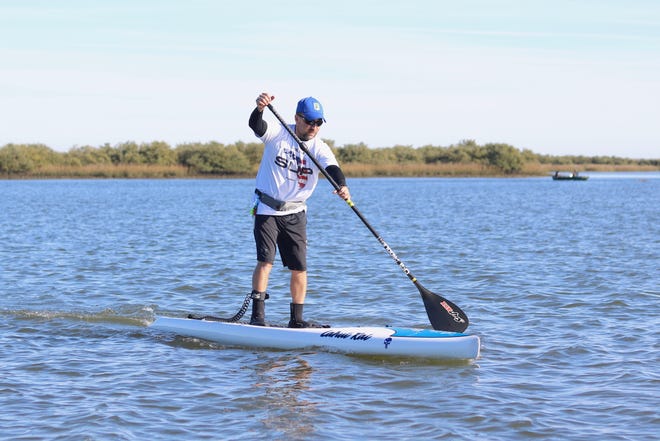 Victor Cabrera, who was furloughed from his job as a maintenance worker at Castillo de San Marcos National Monument during the partial government shutdown that lasted 35 days, is offering free stand up paddleboard tours to others who are unable to work like him. [TRAVIS GIBSON/THE RECORD]