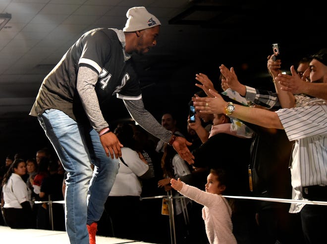 Chicago White Sox's Eloy Jimenez is introduced to fans during the baseball team's convention Friday, Jan. 25, 2019, in Chicago. (AP Photo/David Banks)