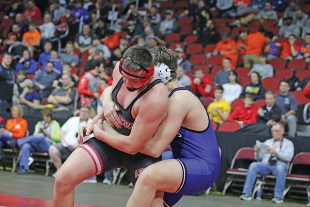 A-D-M’s Kaden Sutton (left) wrestles Kobe Simon of West Liberty in the first round of the 2018 State Wrestling Tournament on Friday, Feb. 15 at Wells Fargo Arena. Sutton advanced to the next round with a win. FILE PHOTO/DALLAS COUNTY NEWS