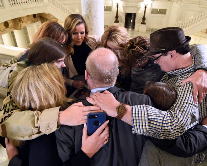(File) Survivors of child sexual abuse hug in the Pennsylvania Capitol in Harrisburg in October, while awaiting legislation to respond to a landmark state grand jury report on child sexual abuse in the Roman Catholic Church. Lawmakers have returned to the Pennsylvania Capitol for 2019 sessions, but they have yet to revisit a response to child sexual abuse scandals since the debate's late-night collapse that closed last year's final voting day. [AP Photo/Marc Levy]