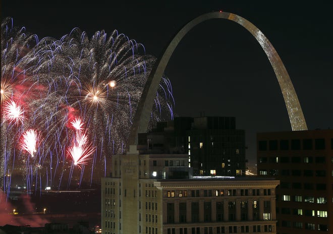 In this July 4, 2018 file photo, fireworks illuminate the night sky near the Gateway Arch in St. Louis. A task force called Better Together on Monday revealed a plan that calls for a statewide vote seeking approval to merge St. Louis city and county. If approved, the new "metropolitan city" would have 1.3 million residents, instantly becoming the nation's 10th largest city. [Jeff Roberson/The Associated Press]