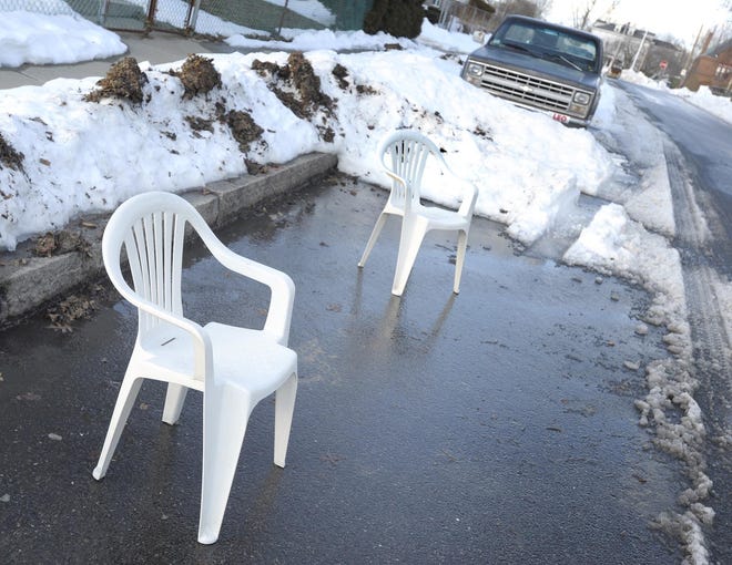 Reserving a parking spot in front of your home - whether with chairs or paint - is illegal in Fall River. [Herald News File Photo]