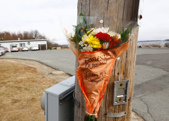 Flowers left outside the American Legion post on Moon Island Road in Quincy in memory of Christopher McCallum, 44, of Bridgewater, who died Monday, Jan. 28, 2019, a day after he was injured in a disturbance. (Greg Derr/The Patriot Ledger)