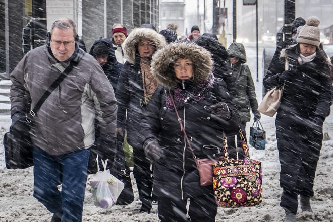 Morning commuters face a tough slog on Wacker Drive in Chicago Monday. [Rich Hein/Chicago Sun-Times via AP]